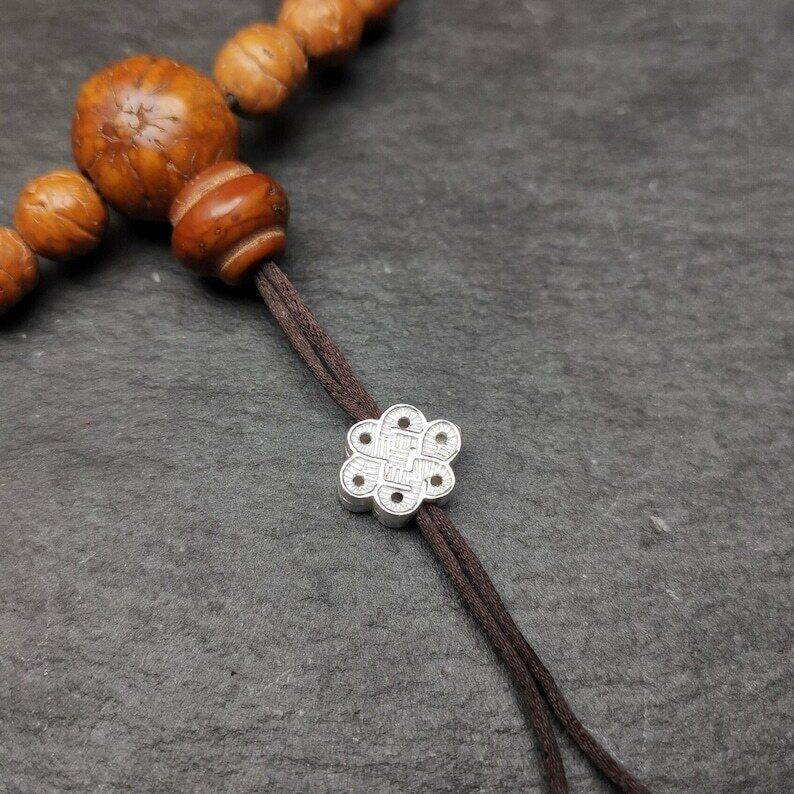 Mala Bead Pendant,Sterling Silver Lucky Knot Bead,Endless Knot - Tibetan Buddhist mala beads, front view