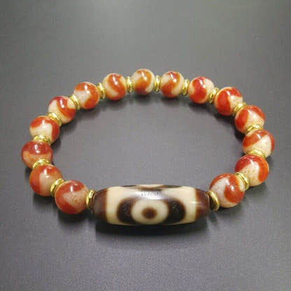 Fire Agate Dzi Bead Bracelet - Tibetan Buddhist mala beads, detailed view