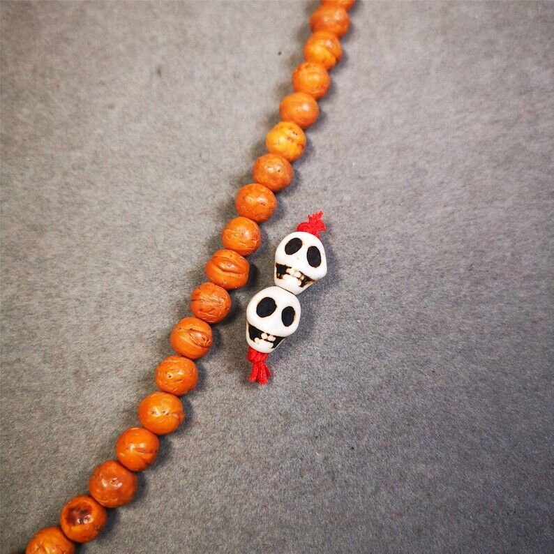 Citipati Skull Marker Beads 0.4" - Tibetan Buddhist art, front view