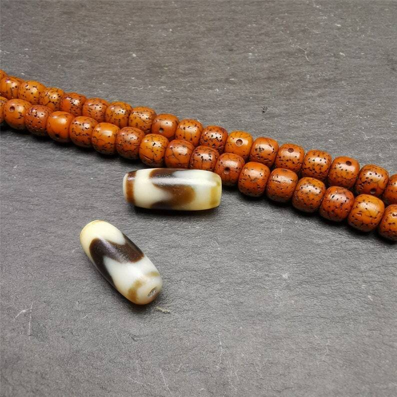 Tiger Tooth Dzi Spacer Marker Beads 0.32" - Tibetan dzi bead, close-up detail
