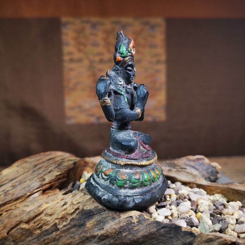 Tibetan Buddha Statue,Chenrezig,Padmapani, Avalokitesvara - Tibetan Buddhist statue, close-up detail