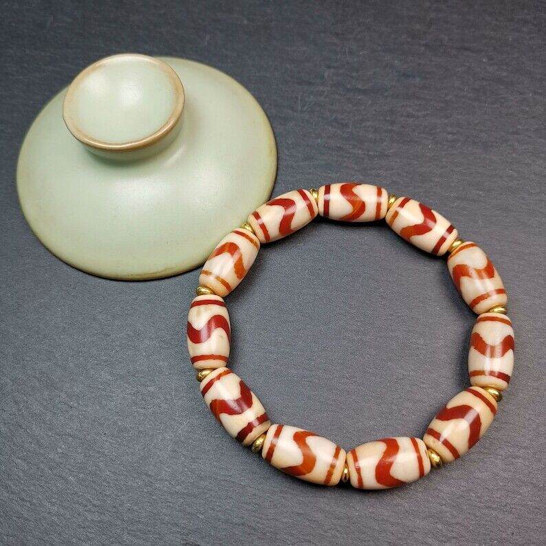Fire Agate Tiger Tooth Dzi Bead Bracelet - Tibetan Buddhist mala beads, detailed view