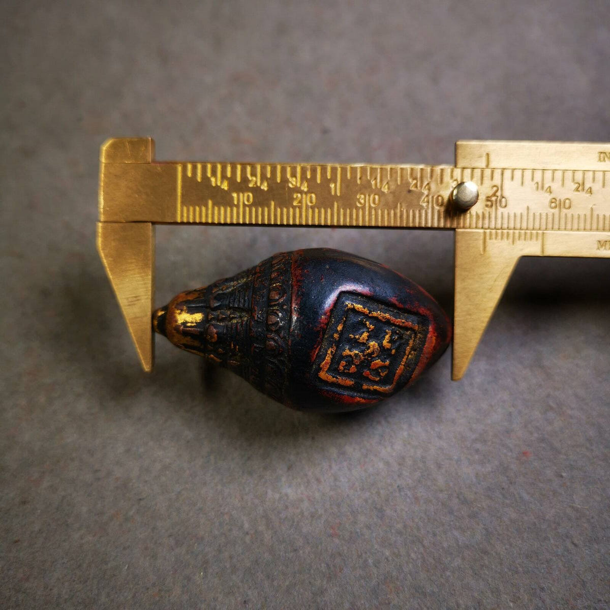 Niang La Tsa Tsa Statue Amulet 1.89" - Tibetan Buddhist amulet, size reference