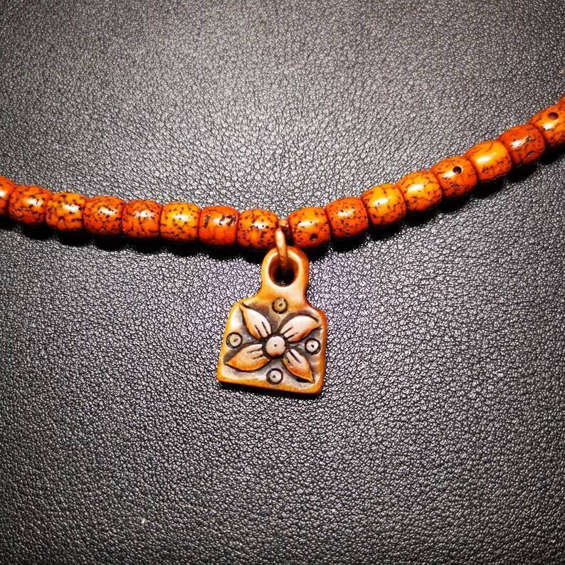 Yak Bone Carved Flower Prayer Bead Pendant - Tibetan Buddhist art, detailed view