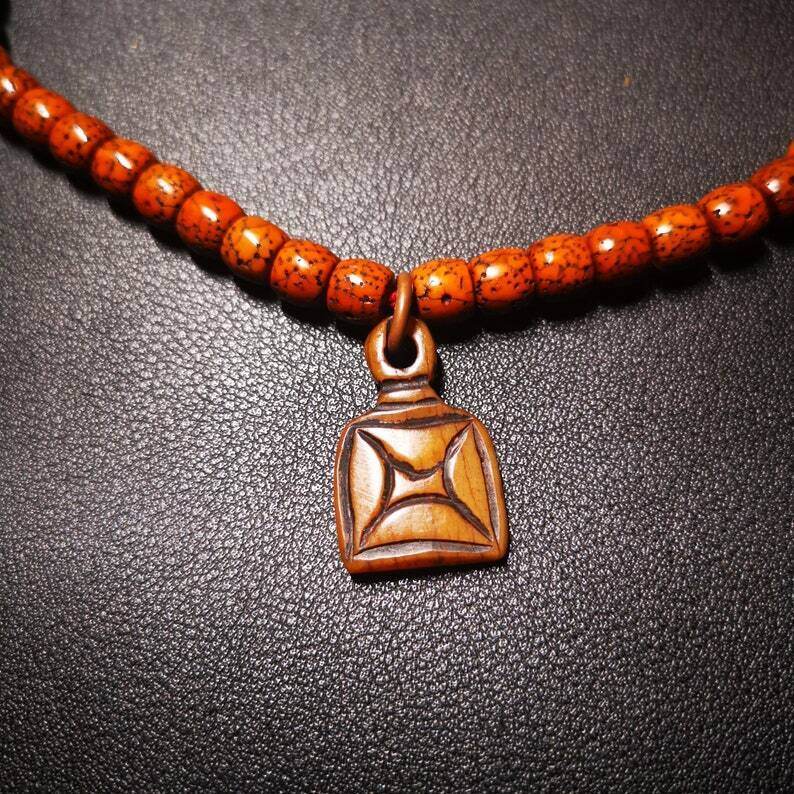 Yak Bone Carved Letter Prayer Bead Pendant - Tibetan Buddhist art, close-up detail
