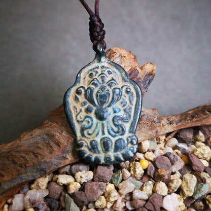 Buddhist Amulet,Lotus Pendant Badge - Tibetan Buddhist amulet, close-up detail