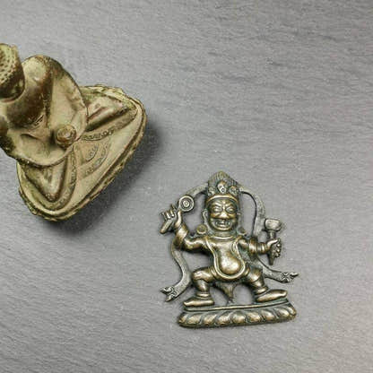 Tibetan Buddhist Statue,Mahakala Holding a Drum - Tibetan Buddhist statue, close-up detail