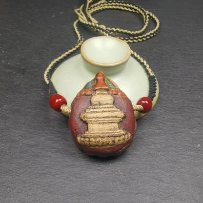Stupa Tsa Tsa Amulet, Scorpion Guru of Padmasambhava, Scorpion Terma Pendant - Tibetan Buddhist amulet, close-up detail