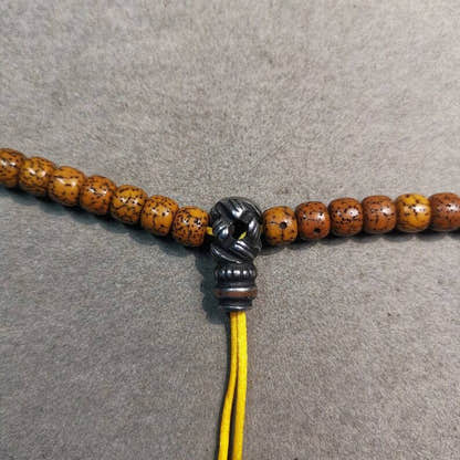 Lucky Knot T-drilled 3-Hole Bead for Prayer Bead,0.8" - Tibetan Buddhist art, close-up detail