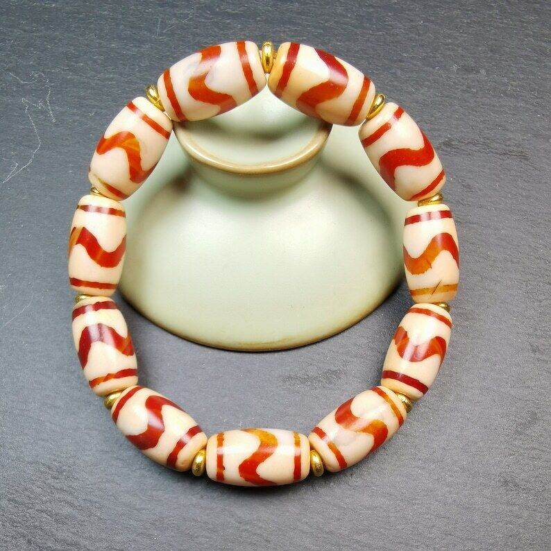Fire Agate Tiger Tooth Dzi Bead Bracelet - Tibetan Buddhist mala beads, front view