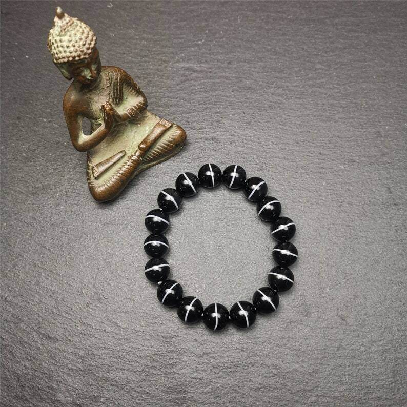 Black Agate Prayer Beads Bracelet - Tibetan Buddhist art, detailed view