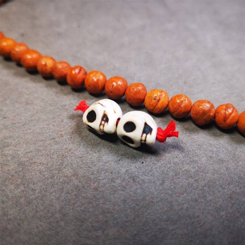 Citipati Skull Marker Beads 0.4" - Tibetan Buddhist art, close-up detail
