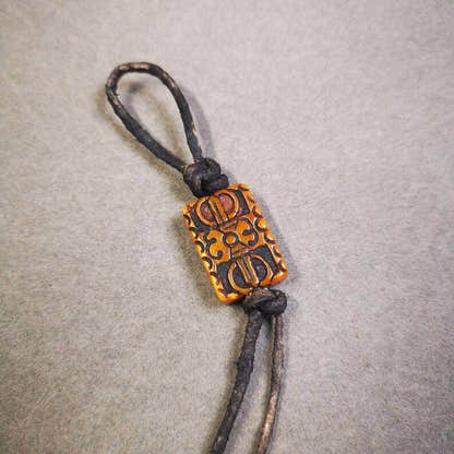 Buddhism Vajra Pendant,Hand Carved Yak Bone Dorje Amulet - Tibetan Buddhist amulet, close-up detail