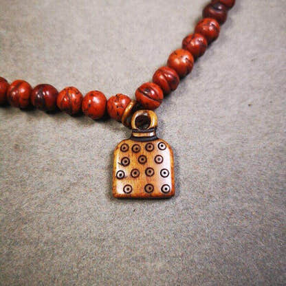 Yak Bone Carved Letter Prayer Bead Pendant - Tibetan Buddhist art, detailed view