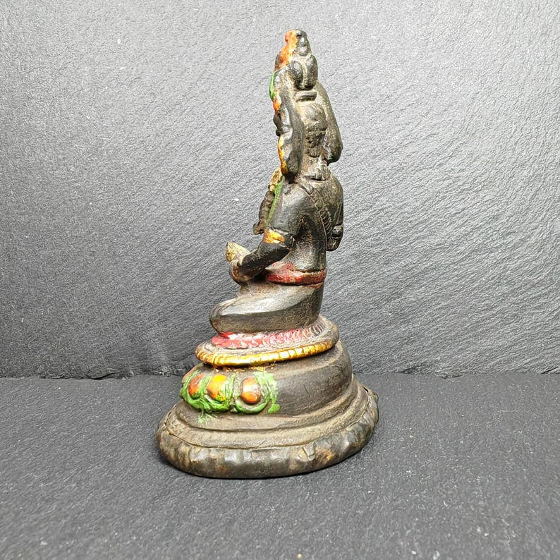 Tibetan Buddha Statue - Tibetan Buddhist statue, close-up detail