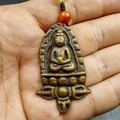 Tibetan Buddhist Amulet - Tibetan Buddhist amulet, detailed view