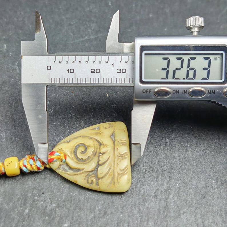 Auspicious Spiral - Eternal Bliss - Hand-carved Tibetan Amulet 32mm - Tibetan Buddhist amulet, size reference