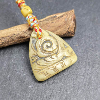 Auspicious Spiral - Eternal Bliss - Hand-carved Tibetan Amulet 32mm - Tibetan Buddhist amulet, close-up detail