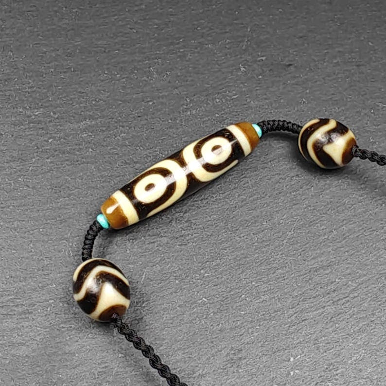 3 Eyes Dzi + Wave Dzi Beads Amulet - Tibetan Buddhist bead necklace, detailed view