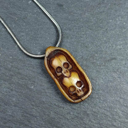 Authentic Yak Bone Carved Dual Skeleton Skull Pendant 30mm - Tibetan Buddhist amulet, front view