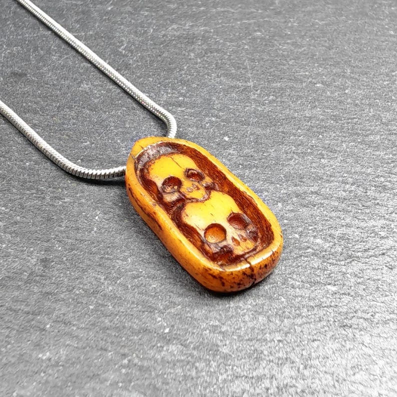 Authentic Yak Bone Carved Dual Skeleton Skull Pendant 30mm - Tibetan Buddhist amulet, detailed view