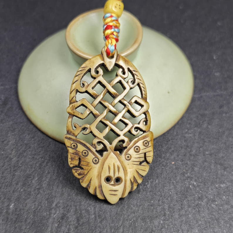 Eternal Knot Endless Knot with Butterfly Hand-carved Amulet - 58*33mm - Tibetan Buddhist amulet, close-up detail