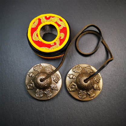 Brass Tingsha Set - Astamangal - 2.6" - Tibetan Buddhist art, close-up detail