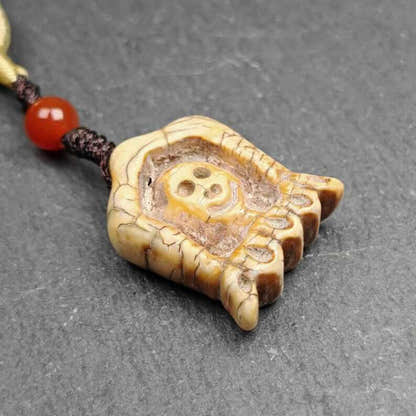 Old Citipati Skull Pendant - Tibetan Buddhist amulet, detailed view