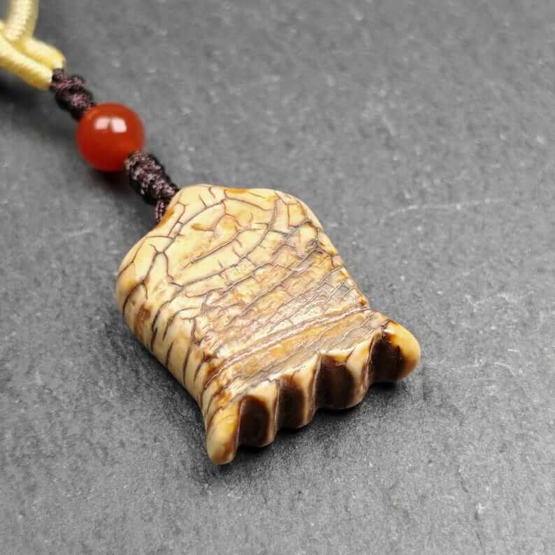Old Citipati Skull Pendant - Tibetan Buddhist amulet, close-up detail