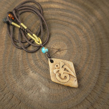 Kapala Amulet Pendant - Hum Syllable - Tibetan Buddhist amulet, front view