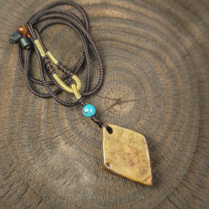 Kapala Amulet Pendant - Hum Syllable - Tibetan Buddhist amulet, close-up detail