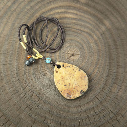Kapala Amulet Pendant - Hum Syllable - Tibetan Buddhist amulet, detailed view