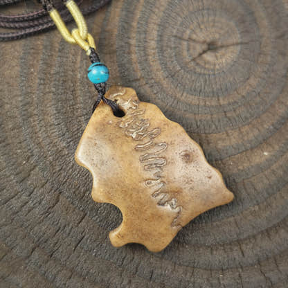 Kapala Amulet Pendant - Free-Form - Tibetan Buddhist amulet, close-up detail
