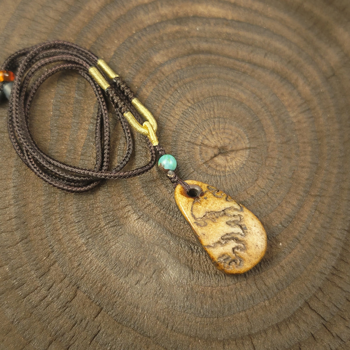 Kapala Amulet Pendant - Conch Shell - Tibetan Buddhist amulet, front view