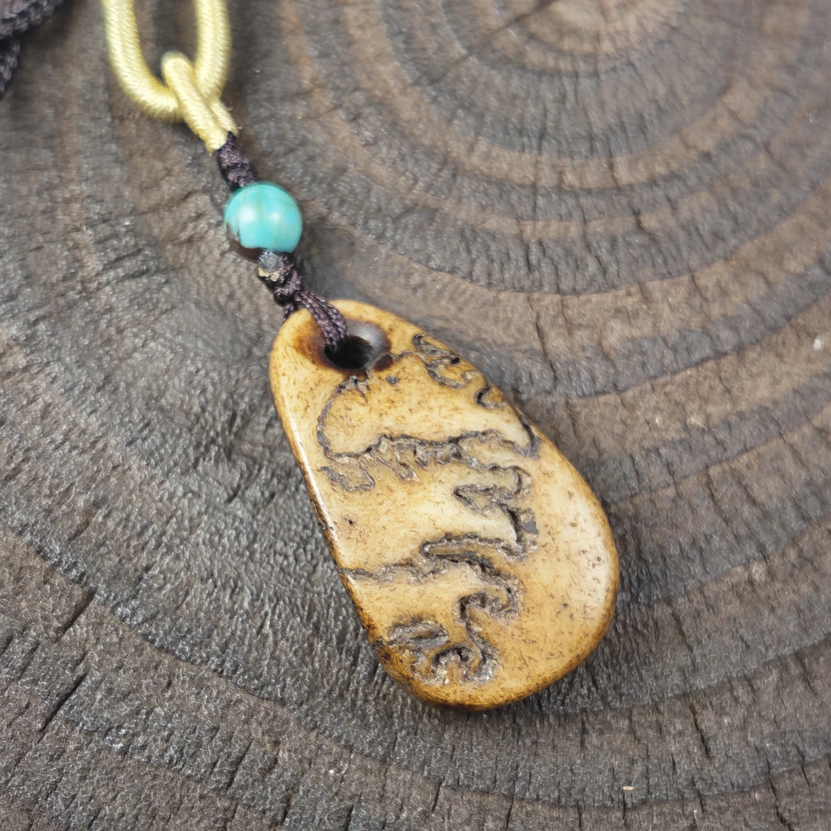 Kapala Amulet Pendant - Conch Shell - Tibetan Buddhist amulet, close-up detail