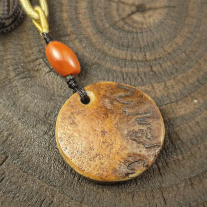 Kapala Amulet Pendant - Round Medallion - Tibetan Buddhist amulet, close-up detail