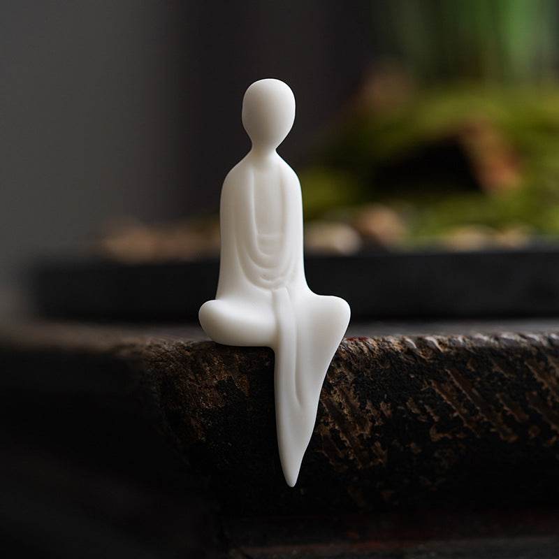 White Ceramic Zen Figurine Ornament - Tibetan Buddhist statue, close-up detail