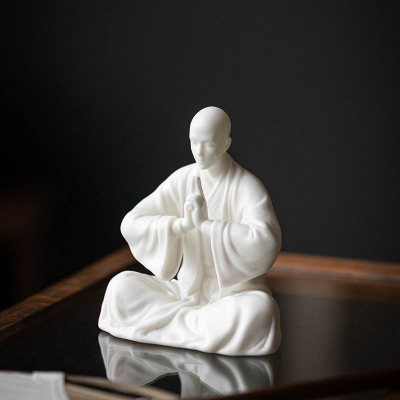 White Porcelain Meditation Buddha Statues - Tibetan Buddhist statue, close-up detail