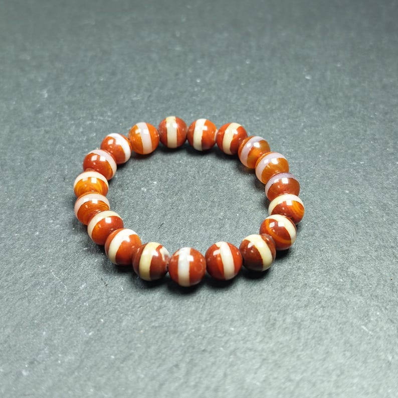 Red Medicine Buddha Dzi Wrist Mala Decades Old - Tibetan Buddhist mala beads, close-up detail