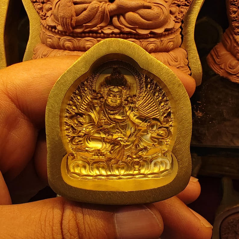 Yellow Jambhala Tsa Tsa Mold - Tibetan tsa tsa mold, detailed view