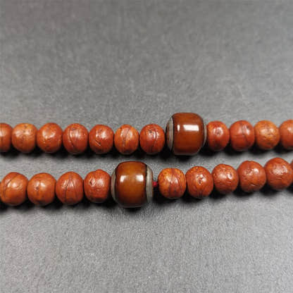 1 Pair of Yak Bone Beads 0.47" - Tibetan Buddhist art, close-up detail