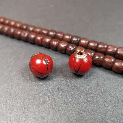1 Pair of Tibetan Plastic Spacer Beads 0.6" - Tibetan Buddhist art, close-up detail