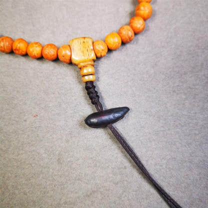 Highland Barley Seed Amulet 0.8" - Tibetan Buddhist amulet, close-up detail