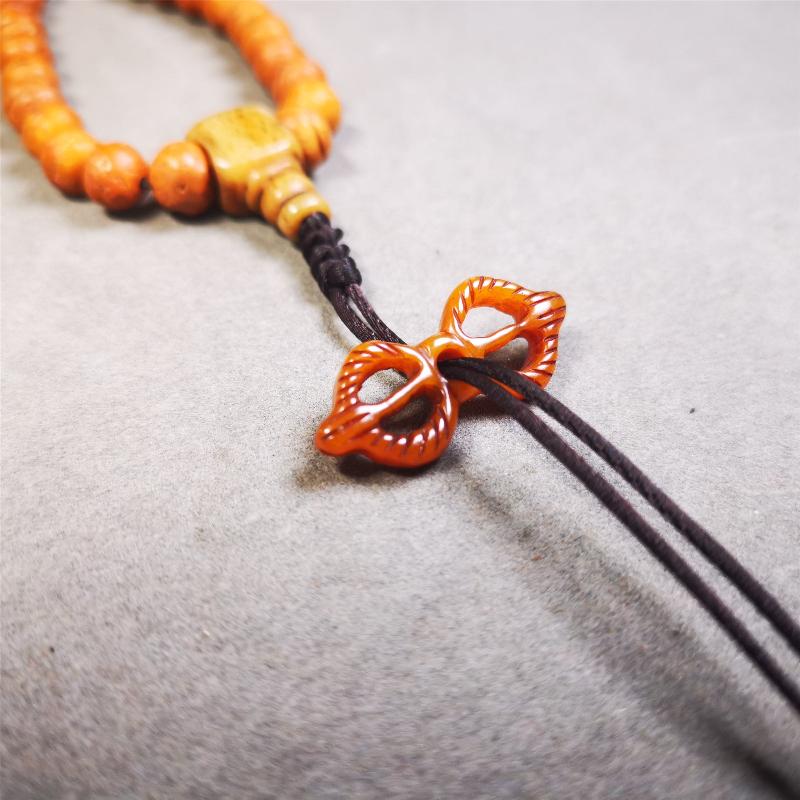 Bone Vajra Amulet 1.18" - Tibetan Buddhist amulet, detailed view