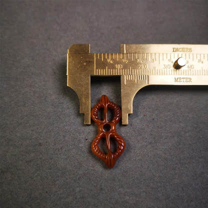 Bone Vajra Amulet 1.18" - Tibetan Buddhist amulet, size reference