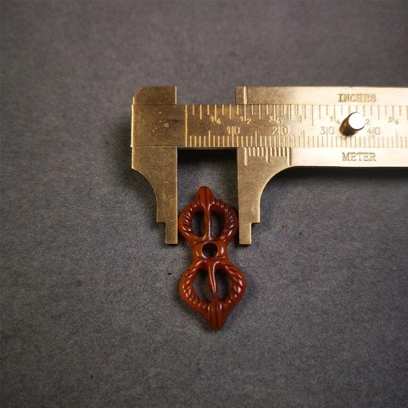 Bone Vajra Amulet 1.18" - Tibetan Buddhist amulet, size reference