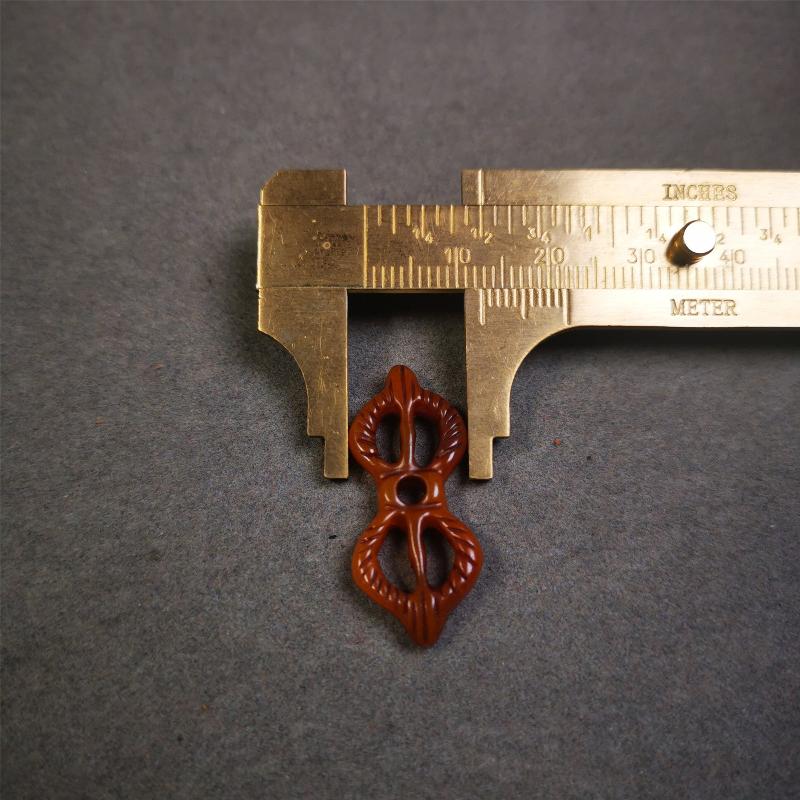 Bone Vajra Amulet 1.18" - Tibetan Buddhist amulet, size reference