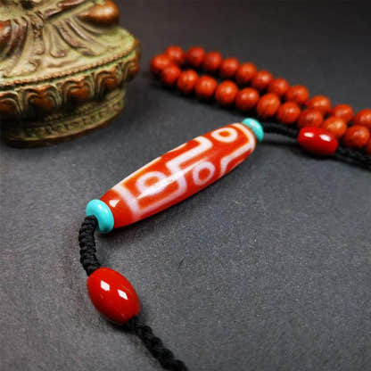 Fire Agate 9 Eyes Dzi Bead Necklace - Tibetan Buddhist bead necklace, close-up detail