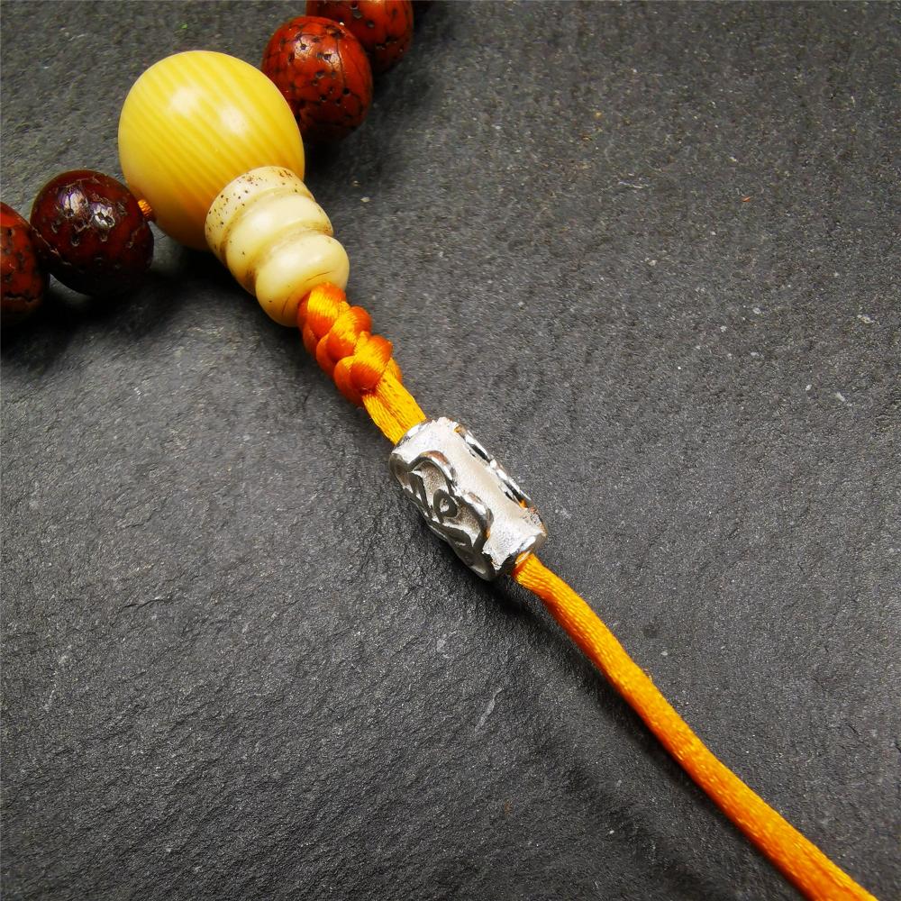 Sterling Silver Lucky Knot Bead,0.4" - Tibetan Buddhist art, close-up detail