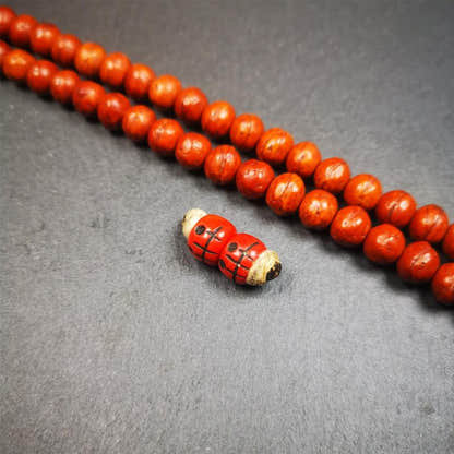 1 Pair of Plastic Skull Beads 0.4" - Tibetan Buddhist art, close-up detail